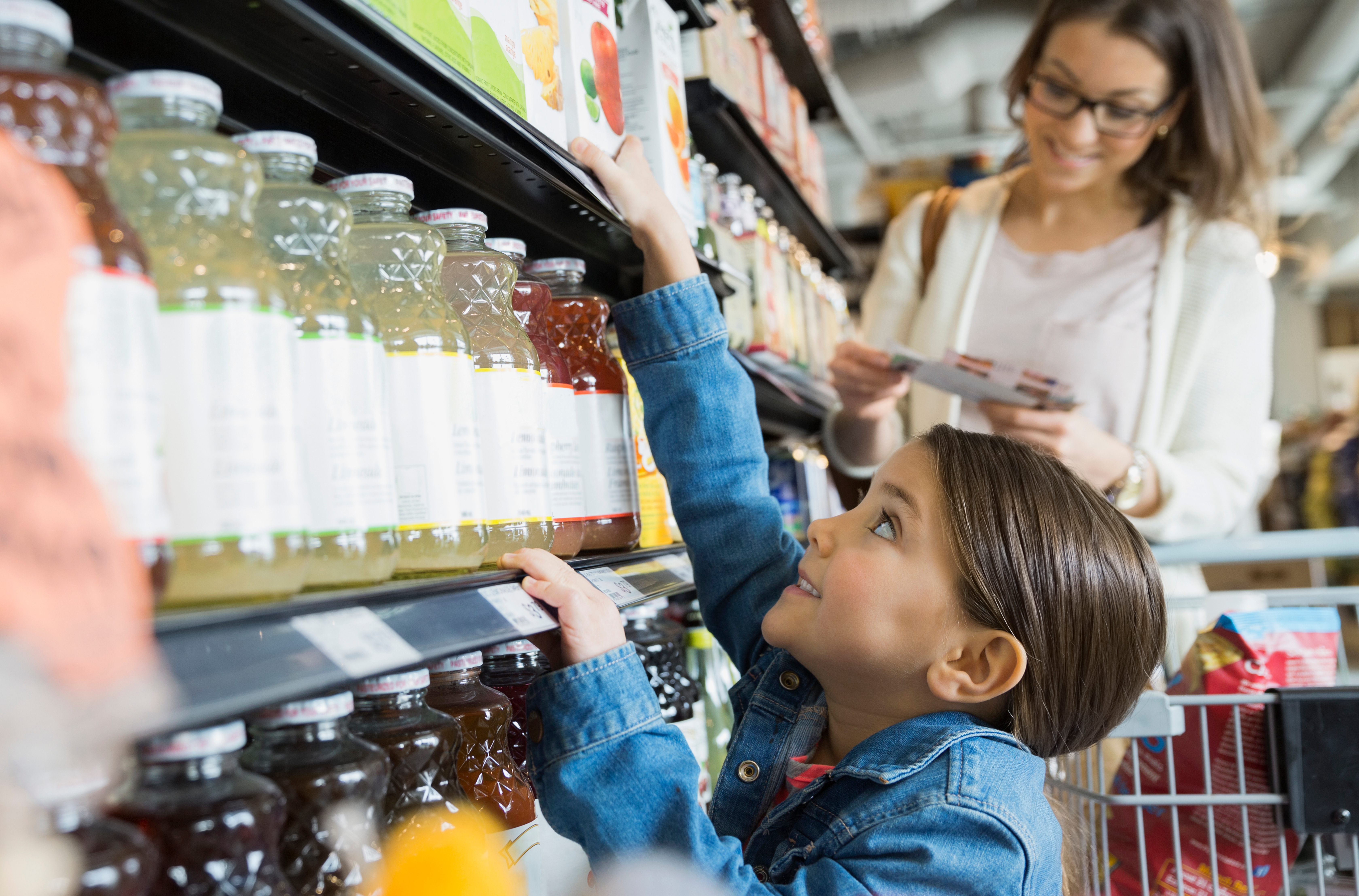 Girl reaching for juice